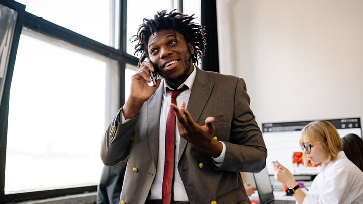 Sales rep on a call with a client