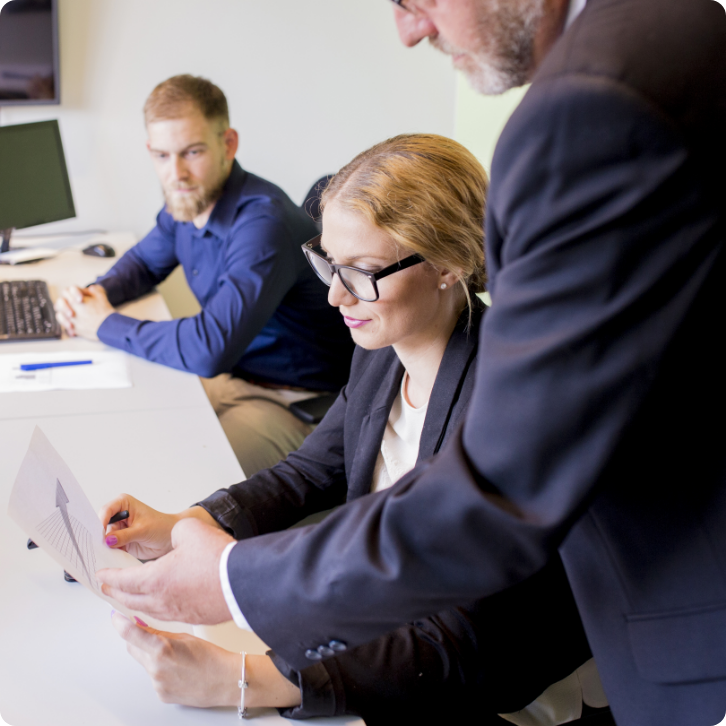 close-up-businessman-showing-business-report-female-colleague-v2 close-up-businessman-showing-business-report-female-colleague-v2